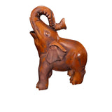 Elefante tallado a mano en madera de nogal con trompa levantada